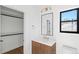 Clean bathroom with a vanity, toilet and access to closet at 4130 Wolff St, Denver, CO 80212