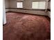 Finished basement with neutral carpeting and large windows at 5941 S Quail Way, Littleton, CO 80127