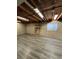 Unfinished basement with laminate flooring at 5941 S Quail Way, Littleton, CO 80127