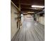 Unfinished basement with gray laminate flooring at 5941 S Quail Way, Littleton, CO 80127