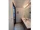 Bathroom features a vanity with sink and mirror at 5941 S Quail Way, Littleton, CO 80127