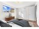 Bedroom with bed, dresser and window at 4170 Chase St, Denver, CO 80212