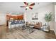 Open living area with wood-style flooring, a fireplace, and access to the kitchen at 6760 Fern Dr, Denver, CO 80221