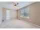 Bright bedroom with neutral walls and carpet at 9357 Lark Sparrow Dr, Highlands Ranch, CO 80126