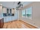 Modern kitchen with white shaker cabinets, granite countertops, and breakfast nook at 9357 Lark Sparrow Dr, Highlands Ranch, CO 80126