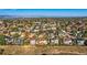 Aerial view of a large residential area with mountain views in the background at 9357 Lark Sparrow Dr, Highlands Ranch, CO 80126