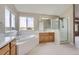 Main bathroom with soaking tub and walk-in shower at 9357 Lark Sparrow Dr, Highlands Ranch, CO 80126