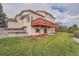 Two-story home with a large deck and backyard at 9357 Lark Sparrow Dr, Highlands Ranch, CO 80126