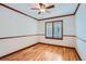 Bright bedroom featuring hardwood floors and plantation shutters at 9357 Lark Sparrow Dr, Highlands Ranch, CO 80126