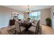 Elegant dining room featuring hardwood floors, a chandelier, and large window with a view at 9357 Lark Sparrow Dr, Highlands Ranch, CO 80126