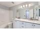 Bathroom with double vanity and updated fixtures at 9357 Lark Sparrow Dr, Highlands Ranch, CO 80126