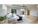 Main bedroom with wood floors, private deck access and en-suite bathroom at 15453 E 109Th Ave, Commerce City, CO 80022