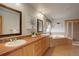Bathroom with double sinks, corner tub, and a separate shower at 15453 E 109Th Ave, Commerce City, CO 80022