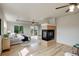 Main bedroom features a fireplace, wood floors and private deck access at 15453 E 109Th Ave, Commerce City, CO 80022