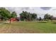 Community park with grassy areas and playground at 15453 E 109Th Ave, Commerce City, CO 80022
