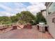 Brick paved patio with built-in grill and space for outdoor furniture at 15453 E 109Th Ave, Commerce City, CO 80022
