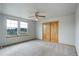 Well-lit bedroom featuring carpet and double doors at 15453 E 109Th Ave, Commerce City, CO 80022