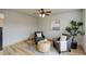Cozy sitting area with two armchairs, coffee table and large plant at 15453 E 109Th Ave, Commerce City, CO 80022