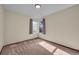 Simple bedroom with two windows and carpet flooring at 9432 W 104Th Way, Broomfield, CO 80021