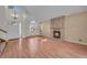 Living room with hardwood floors, fireplace and front window at 9432 W 104Th Way, Broomfield, CO 80021