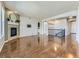 Open concept living room with hardwood floors, fireplace, and elevated views at 2349 Leafdale Cir, Castle Rock, CO 80109