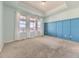 Bright main bedroom with carpeted floor and large windows offering scenic views at 2349 Leafdale Cir, Castle Rock, CO 80109