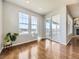 Bright sunroom with hardwood floors, large windows, and access to a deck at 2349 Leafdale Cir, Castle Rock, CO 80109