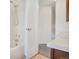 Clean bathroom with tub, shower, and door to another room at 10255 Travertine Pl, Parker, CO 80134