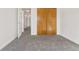 Bedroom with carpet, door to hallway and closet at 10255 Travertine Pl, Parker, CO 80134