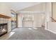 Spacious living room with a fireplace, open to kitchen and breakfast bar at 10255 Travertine Pl, Parker, CO 80134