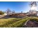 Large backyard with a grassy area and partial fence visible at 11343 W 60Th Pl, Arvada, CO 80004