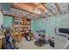 Finished basement room with shelving and workspace at 11343 W 60Th Pl, Arvada, CO 80004