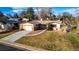 Single story house with attached garage and landscaping at 11343 W 60Th Pl, Arvada, CO 80004