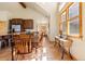 Bright dining area with wood table and chairs, adjacent to kitchen at 73 Maggie Placer Loop, Breckenridge, CO 80424