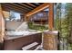 Relaxing hot tub on a deck overlooking the backyard at 73 Maggie Placer Loop, Breckenridge, CO 80424