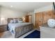 King-size bed in a main bedroom with access to bathroom and closet at 73 Maggie Placer Loop, Breckenridge, CO 80424