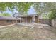 Backyard with patio, deck, and storage shed at 10521 Inca St, Northglenn, CO 80234