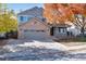 Two-story home with gray siding and a two-car garage at 6731 S Newcombe Way, Littleton, CO 80127