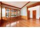 Spacious dining room with hardwood floors and large windows at 6731 S Newcombe Way, Littleton, CO 80127