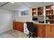 Finished basement office with built-in desk and shelving at 3525 W 26Th Ave, Denver, CO 80211