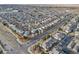 Aerial view of the neighborhood, showcasing nearby houses, roads, and trees at 4905 N Kalispell St, Denver, CO 80239