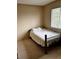 Simple bedroom with carpeted floor and a metal bed frame at 21030 E 39Th Ave, Denver, CO 80249