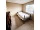 Bright bedroom with carpeted floor, double bed, and dresser at 21030 E 39Th Ave, Denver, CO 80249