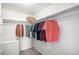 Well-organized closet with hanging clothes and shelving at 9155 E Center Ave # 10A, Denver, CO 80247