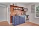 Small galley kitchen with wood shelving and modern appliances at 9300 Wadsworth Blvd, Broomfield, CO 80021