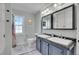 Updated bathroom with double vanity, and a tile shower/tub combo at 9300 Wadsworth Blvd, Broomfield, CO 80021