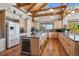 Spacious kitchen featuring granite countertops and island with seating at 4880 Tall Horse Trl, Sedalia, CO 80135