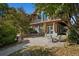 Peaceful patio with seating area, adjacent to a two-story home at 4880 Tall Horse Trl, Sedalia, CO 80135