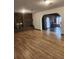 Hardwood floors and a view through to another room with a fireplace at 2163 S Field St, Lakewood, CO 80227