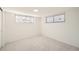 Bright and spacious basement room with neutral carpeting at 3225 W Scott Pl, Denver, CO 80211